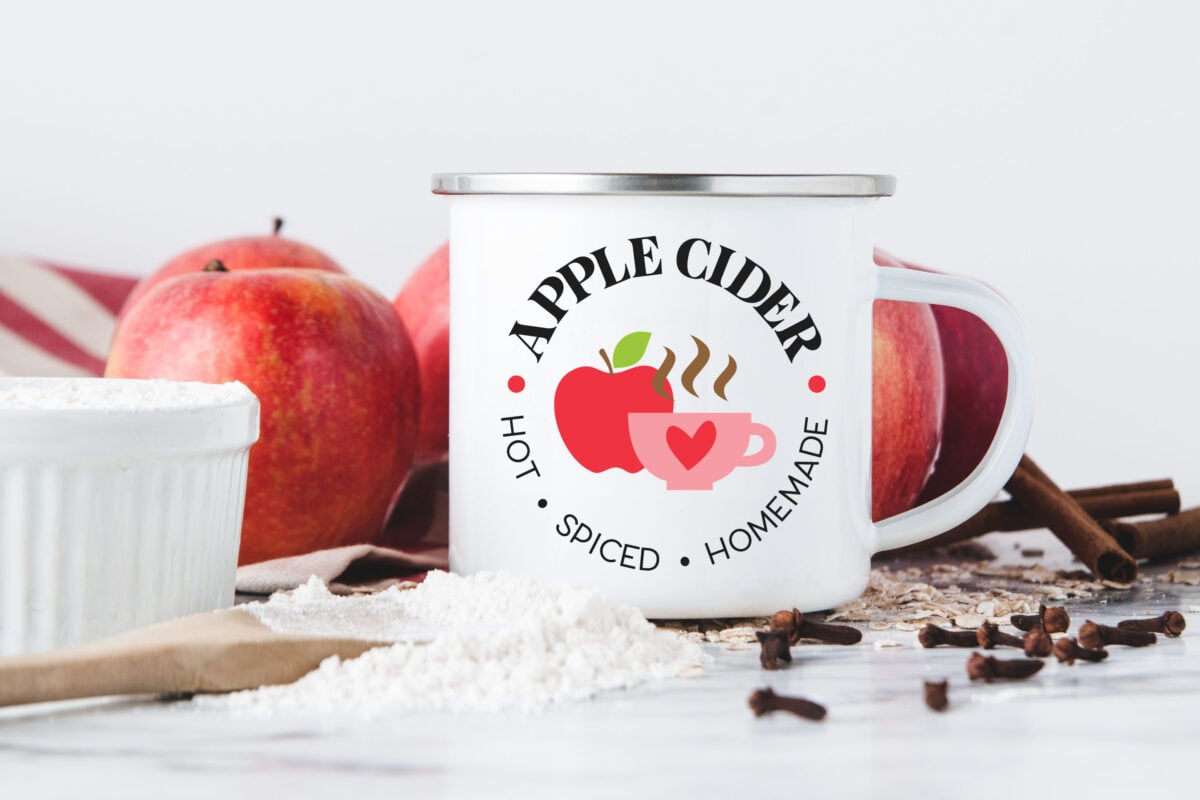 Apple cider SVG on a mug with apples and cloves