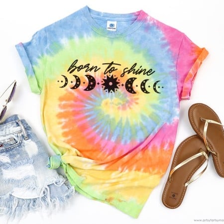 Rainbow tie dyed t-shirt with moon images and the words Born to Shine