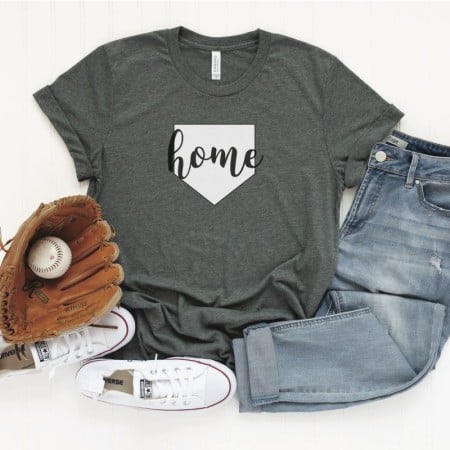 Blue jeans, shoes, ball and mitt with gray t-shirt showing baseball home plate design with the word home on it