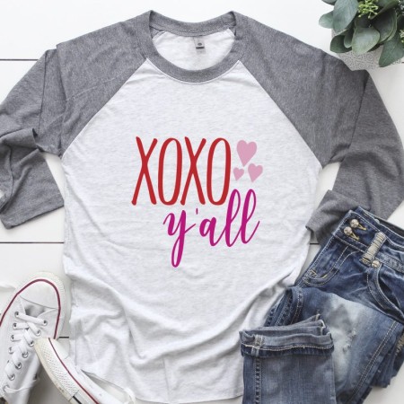 Gray and white baseball style shirt that says XOXO y'all