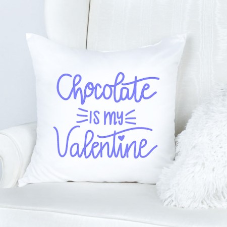 White pillow with lavender colored wording that says Chocolate in my Valentine