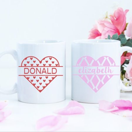 2 white mugs with monogrammed designs on them