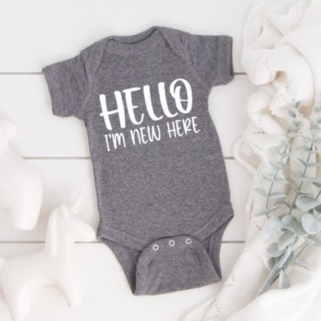 Dark gray onesie that says Hello I'm New Here