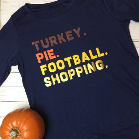 Black t-shirt decorated with the words, Turkey, Pie, Football and Shopping