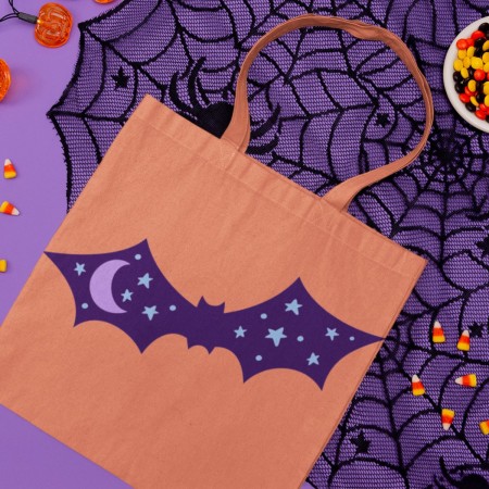 Orange tote with a bat design on it
