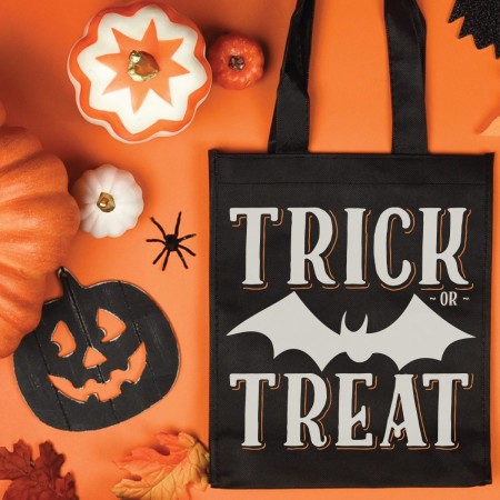 Black tote bag decorated with a bat and the words Trick or Treat