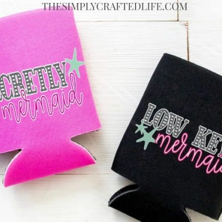 A black and a pink koozie. Pink one says Secretly a Mermaid and the black one says Low Key Mermaid