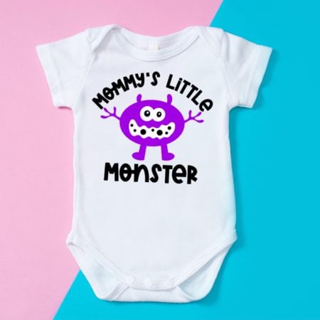 White onesie with a monster image on it and the saying Mommy's Little Monster
