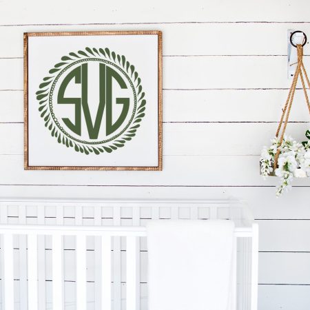 Image of a monogrammed laurel wreath in a picture frame
