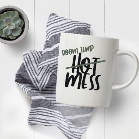 White coffee mug with the saying Hot Mess but with the word Hot crossed out and replaced with Room Temp