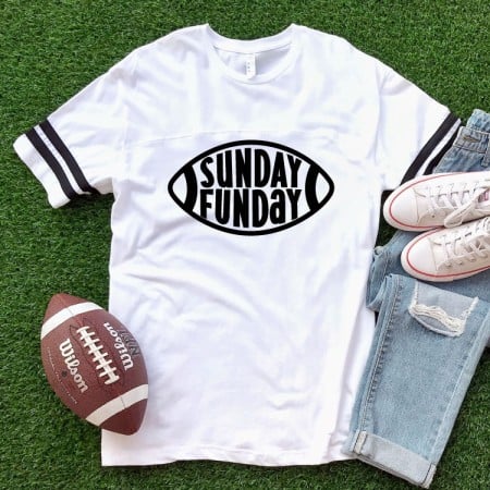 White t-shirt iwht a football shape and the words Sunday Funday on it