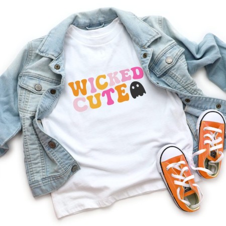 Wicked cute image on white t-shirt with jean jacket and orange Converse.