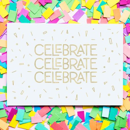 A greeting card with the word Celebrate on it three times