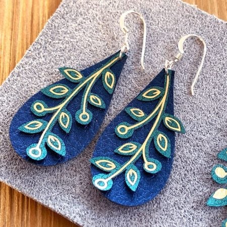 A pair of leaf vine peacock earrings