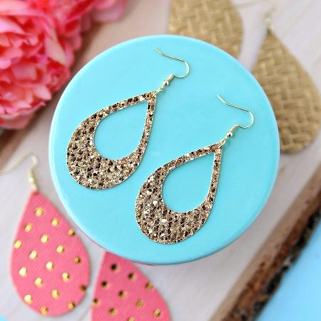A pair of glittery gold earrings
