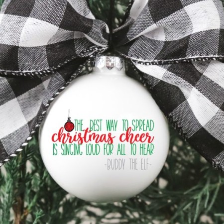 White Christmas ornament with a black and white checkered bow on it and a Buddy the Elf quote from the "ELF" movie