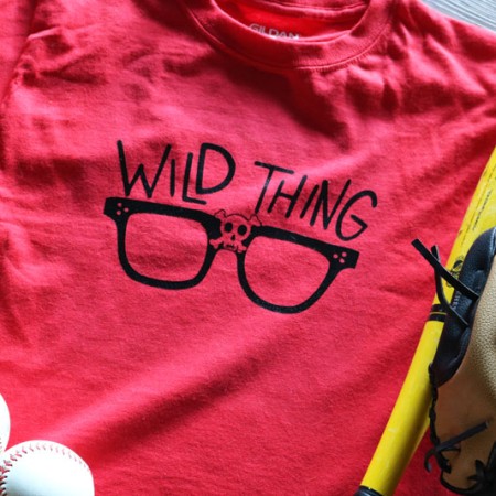 Red t-shirt with eye glasses on it and the saying Wild Thing