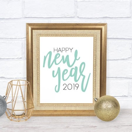 Gold framed sign that says Happy New Year 2019