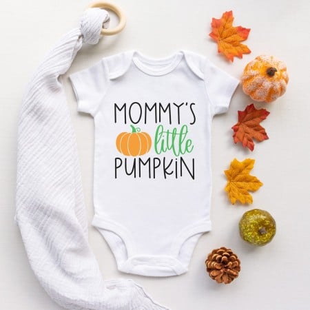 White onesie with image of a pumpkin and the words, Mommy's Little Pumpkin