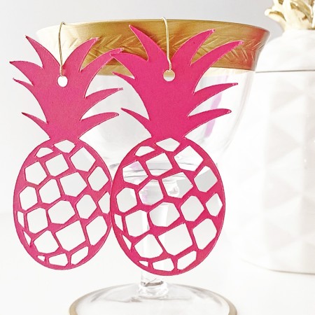 A pair of pink pineapple shaped earrings