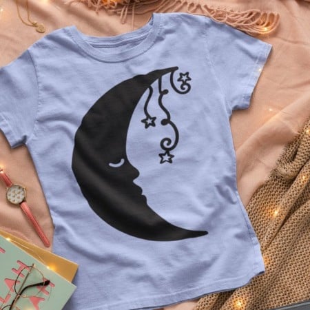 A blue t-shirt with an image of a fancy moon on it