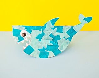 A shark made out of various shades of blue tissue paper