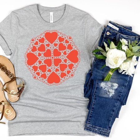 A gray t-shirt decorated with red hearts