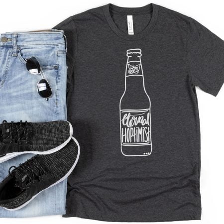 Black t-shirt with an image of a beer bottle on it that says Eternal Hoptimist