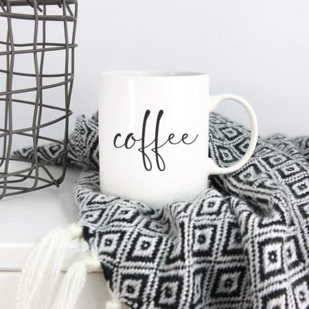 White mug with the word Coffee on it