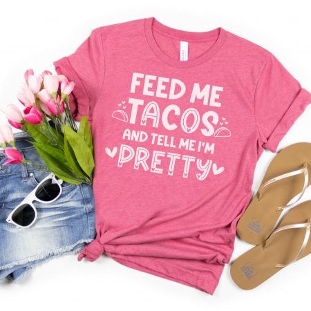 Pink t-shirt that says Feed Me Tacos and Tell me I'm Pretty