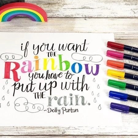 Hand lettered rainbow quote that says If You Want the Rainbow You Have to Put Up With the Rain