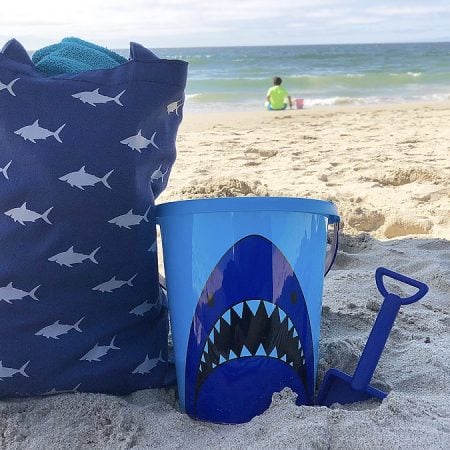 Blue beach bag with an image of a shark on it