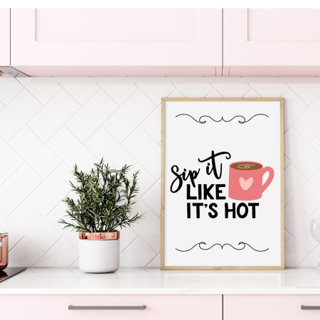 Framed picture with a coffee mug on it and the words Sip it Like it's Hot