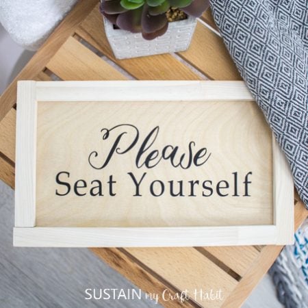 Sign for the bathroom that says, Please Seat Yourself