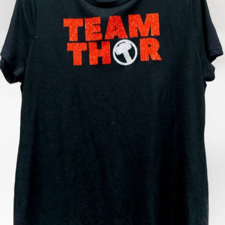 A black t-shirt with a Marvel Avengers themed saying Team Thor