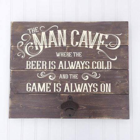 Distressed wood “Man Cave” sign with an attached cast iron bottle opener.