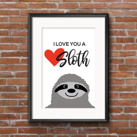 A white framed picture of a sloth, a red heart and the saying I Love You a Sloth