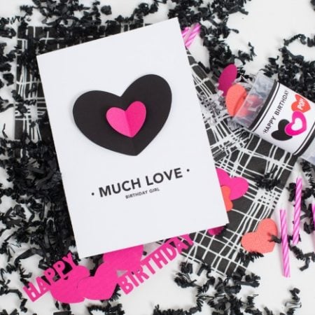 White card with black and pink heart on it and with the saying Much Love Birthday Girl