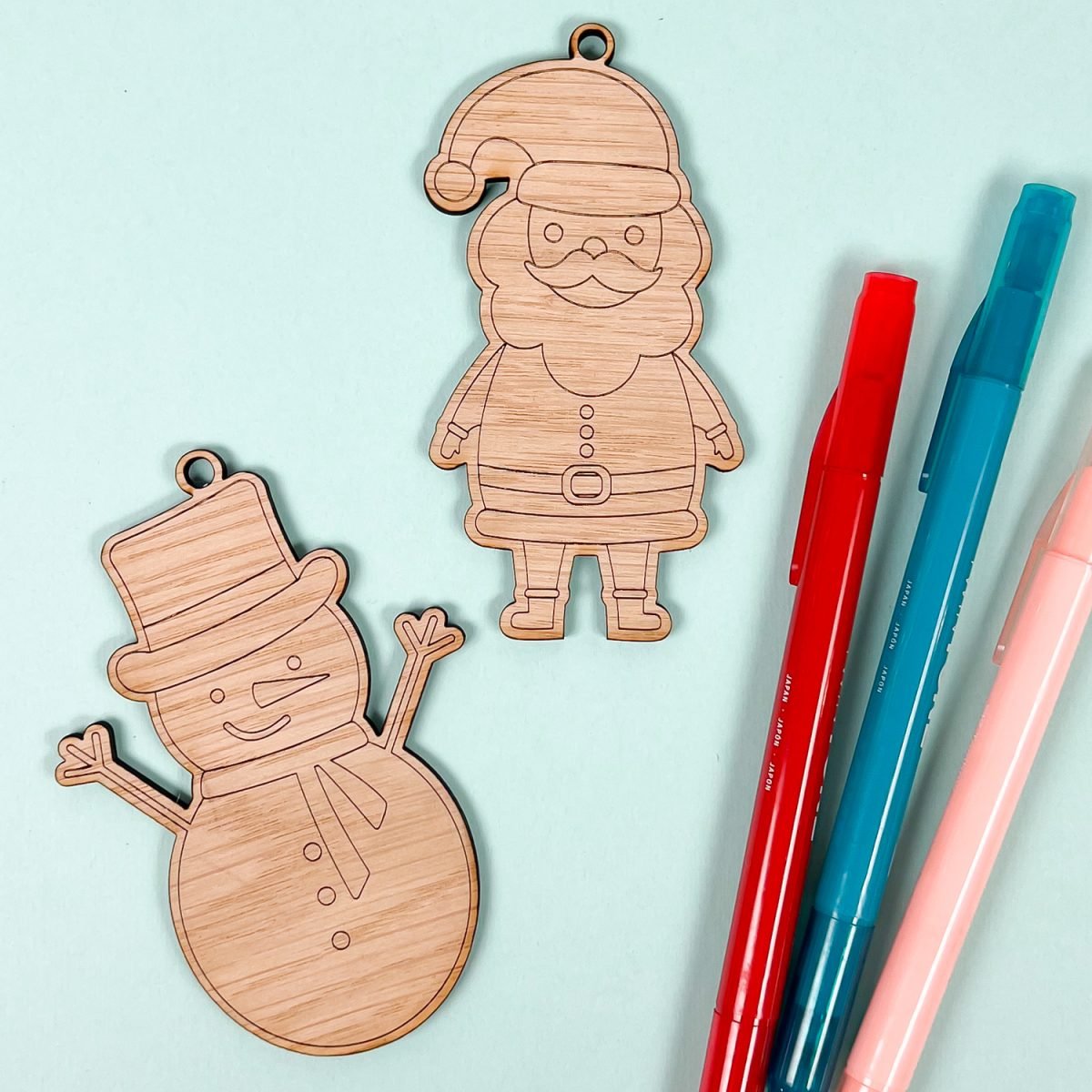 Snowman and santa ornament with colorful pens
