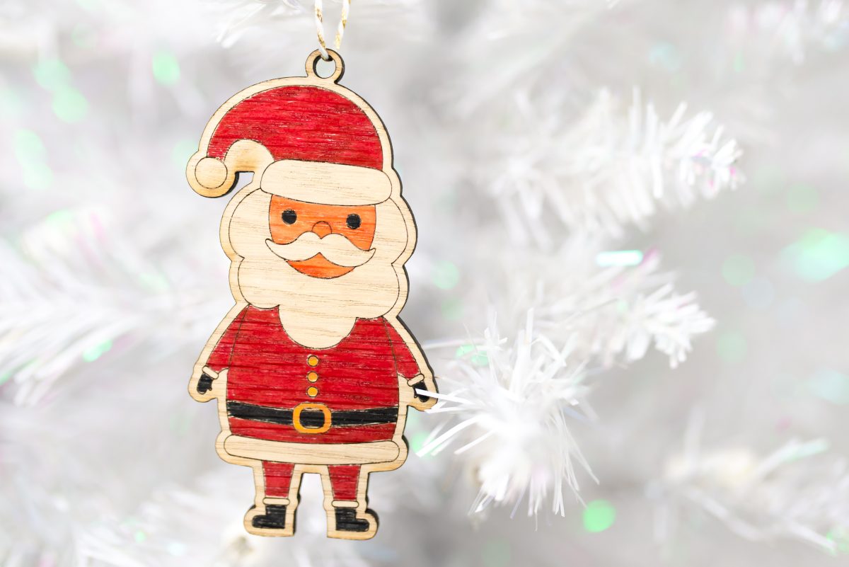 colored santa ornament on white tree