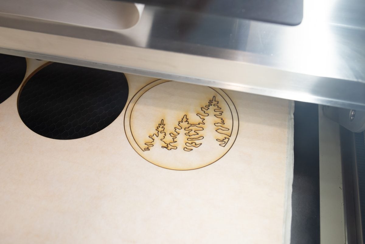 Glowforge cutting wood ornament.