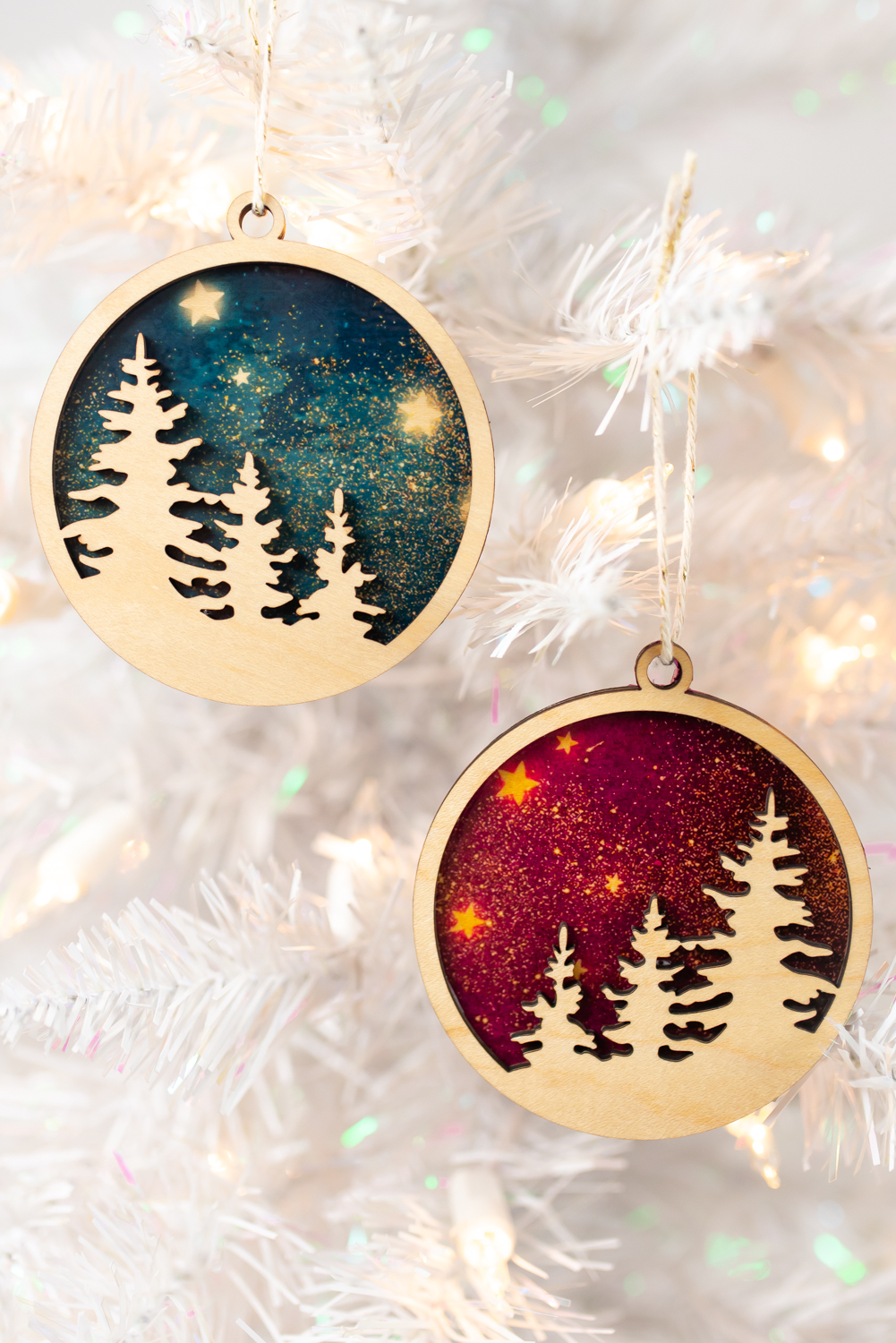 Final sublimation ornaments on white Christmas tree.