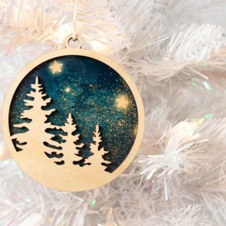 Final sublimation ornament on white Christmas tree.