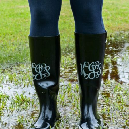 Image of a lady wearing rainboots that are monogramed