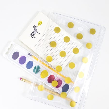 A vinyl pencil pouch decorated with gold dots