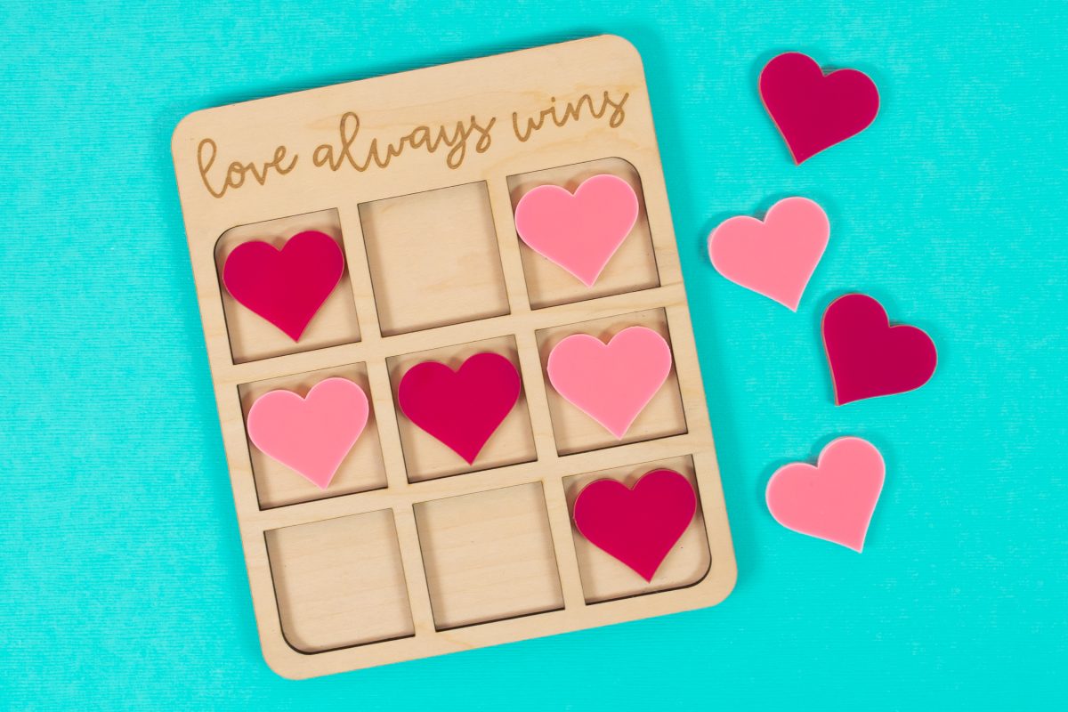 Valentine's Day Tic Tac Toe game on blue background