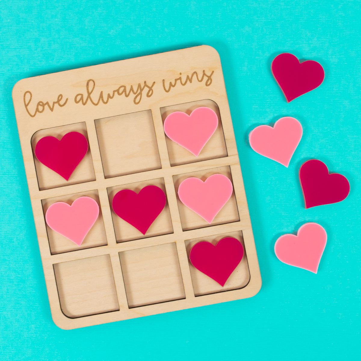 Valentine's Day Tic Tac Toe game on blue background