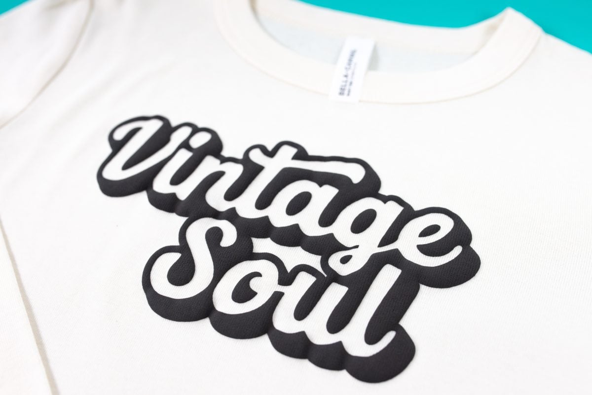 Vintage Soul SVG made with Puff HTV on a cream-colored baby tee on a teal background