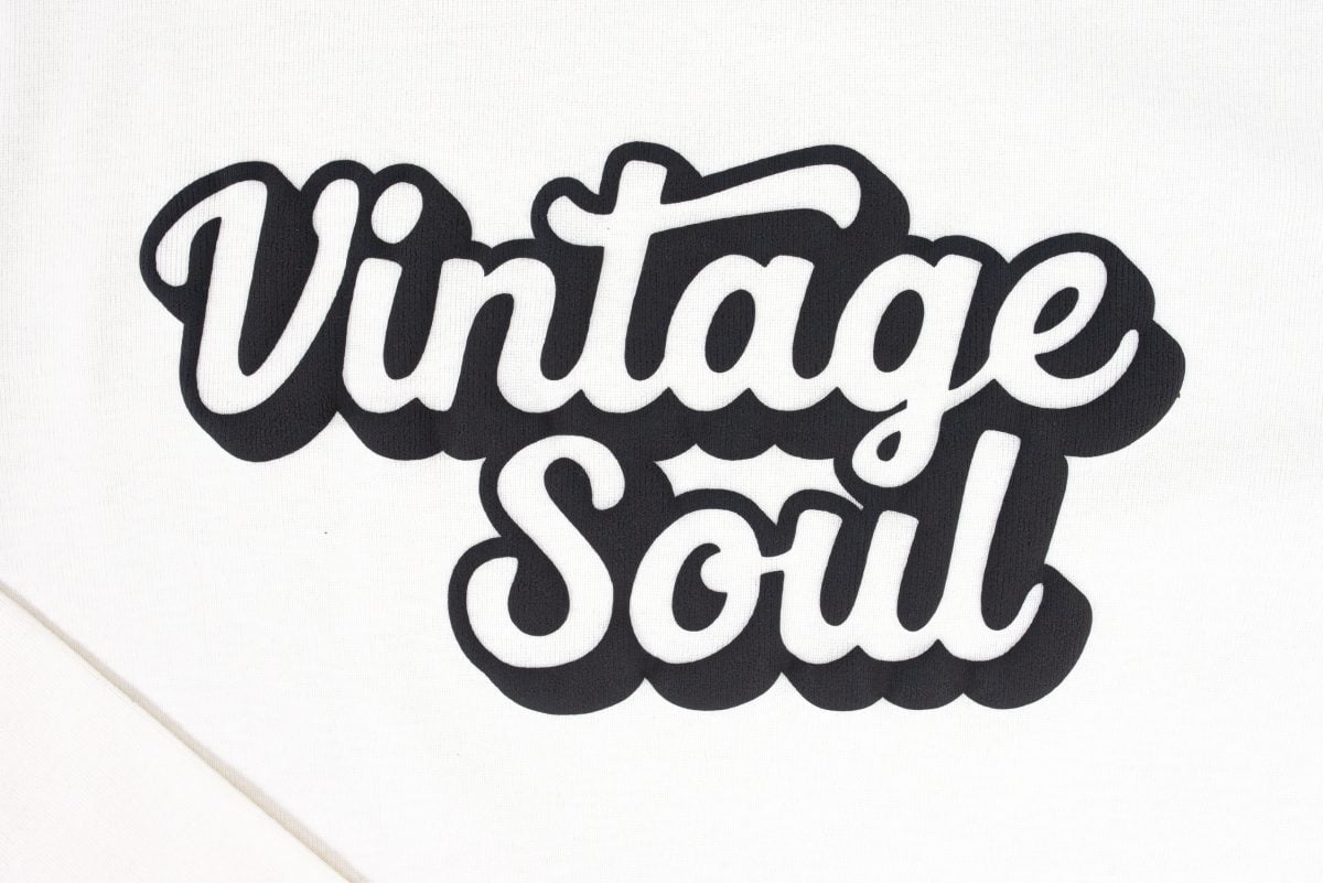 Close up of Vintage Soul SVG made with Puff HTV on a cream-colored baby tee