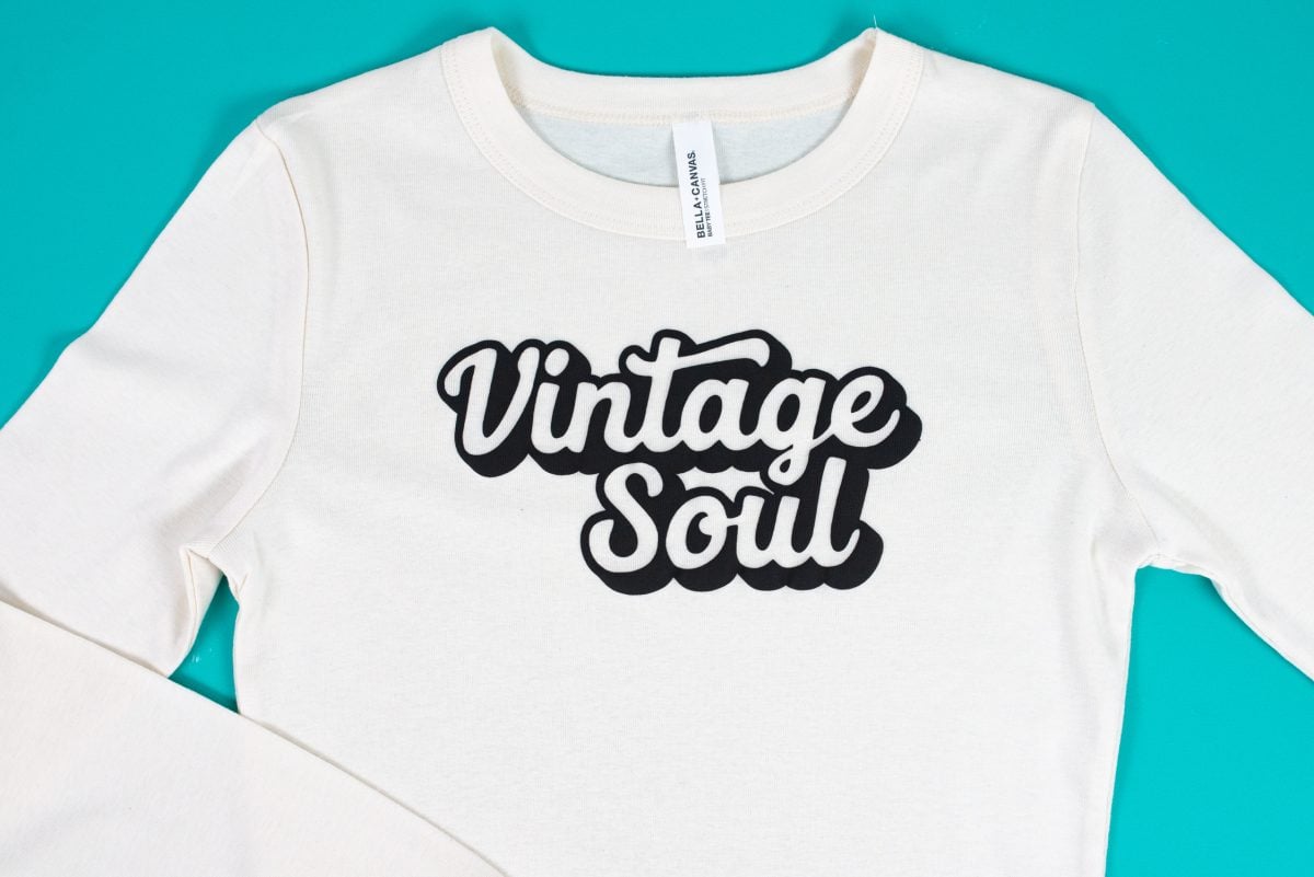 Vintage Soul SVG made with Puff HTV on a cream-colored baby tee on a teal background